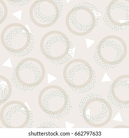 Memphis design. Geometric abstract seamless pattern. Yellow, white and green figures. Dots circles on a beige background. Trend of the 80s, 90s. Modern print. Funky background.