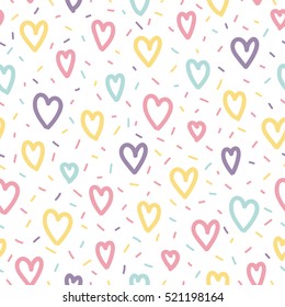 Memphis seamless pattern design with hearts and confetti