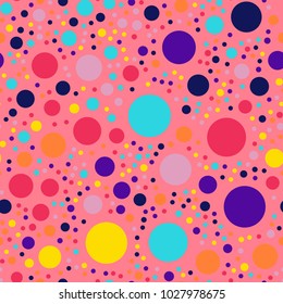Memphis style polka dots seamless pattern on coral background.