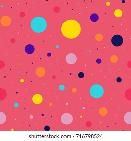 Memphis style polka dots seamless pattern on pink background.