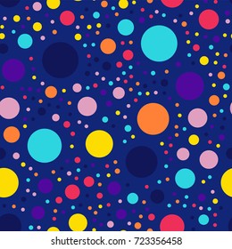 Memphis style polka dots seamless pattern on dark blue background.