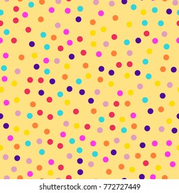 Memphis style polka dots seamless pattern on yellow background.