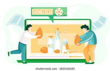 Los hombres llevan almendras en sus manos para hacer leche natural orgánica a partir de ella. Película sobre leche a base de plantas. Hombres con nueces al fondo de la pantalla de una tableta con un video sobre veganismo y leche vegana