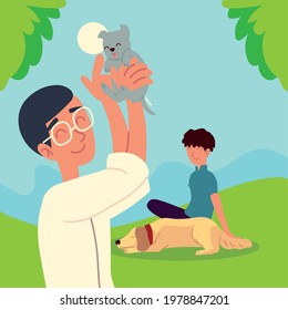 men with dogs playing, resting on grass
