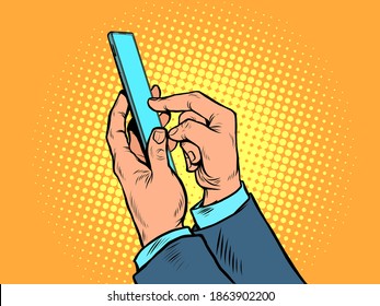 Men hands with a smartphone. Business Internet communication. pop art retro vector illustration kitsch vintage drawing 50s 60s style