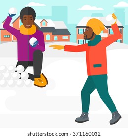 Men playing in snowballs.