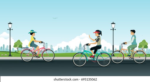 Men and women are riding bicycles in gardens with city backdrops.