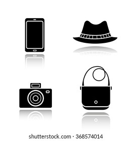 Men's accessories drop shadow black icons set. Homburg hat, slr photo camera, smart phone and handbag. Everyday carry items. Modern gadgets and fashion symbols. Logo concepts. Vector illustrations