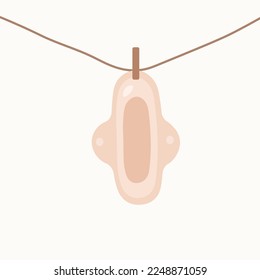 Almohadilla reutilizable ecológica de basura cero menstrual colgada de la cuerda obteniendo una ilustración seca.