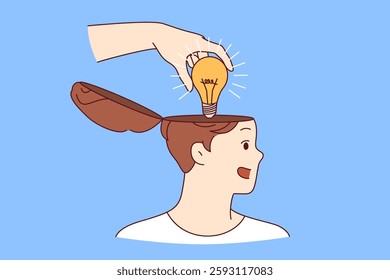 Mentor hand puts idea in shape of light bulb into man head, symbolizing training and valuable advice that causes personal development. Teacher giving idea to student during proper educational process