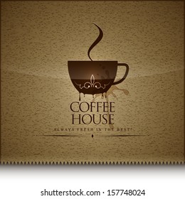 The menu for the coffee house with spilled coffee on the background.