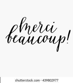 Merci beaucoup, hand written phrase in French, meaning "Thank you very much".  Hand lettering. Modern calligraphy. Hand drawn isolated vector design elements.