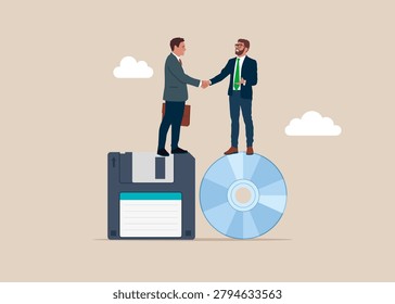 Mergers and acquisitions between the past and the future. Businessmen handshake on compact Disk or CD RW and 3.5
