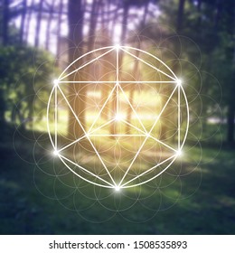 Merkaba sacred geometry spiritual new age futuristic illustration with interlocking circles, triangles and glowing particles in front of blurry natural photographic background