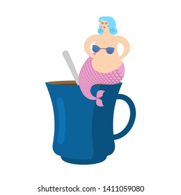 Mermaid in cup. Woman with fish tail in coffee mug 

