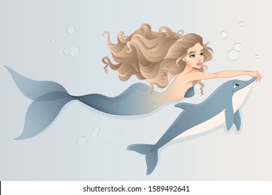 Mermaid with dolphin swimming in the sea