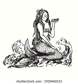 Mermaid sitting rock 