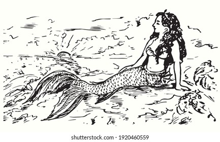 Mermaid sitting rock 
