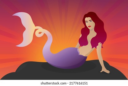 Mermaid sitting rock at