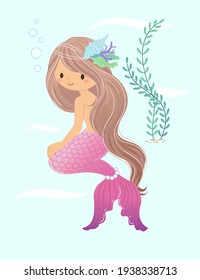 The mermaid smiles and looks ahead, sitting on the ground with seaweed in the background