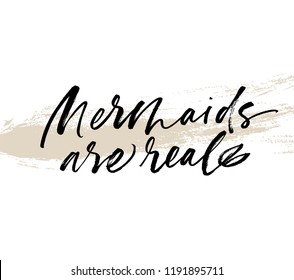 Mermaids are real phrase on brushstroke. Ink illustration. Inspirational quote. Modern brush calligraphy. Hand drawn typography design. 