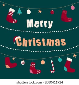 Merry christmas 2022 greeting card with garlands, socks and toys on green background.