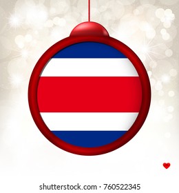 Merry Christmas Ball with Flag Costa Rica on a light beige blur background. Vector illustration.