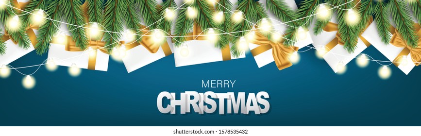 Merry Christmas banner or header. Realistic luxurious winter holiday design - white presents boxes with golden ribbon and bow, garland lights on green spruce tree branches. Hand written lettering.