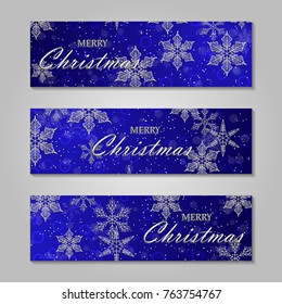 Merry Christmas banner with origami white snowflake. Festive Xmas and New Year collection on blue background.
