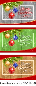 Merry Christmas banner set with fir and balls on wooden ground. Calligraphy with decorative design can be used for invitations, post cards, announcements