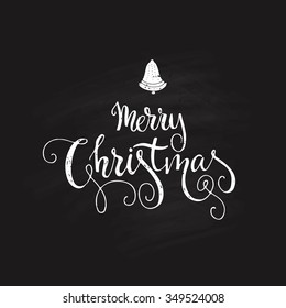 Merry Christmas - beautiful design element isolated on chalk background. Christmas calligraphy.