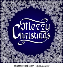 Merry Christmas calligraphic lettering on a blue background with snowflakes.