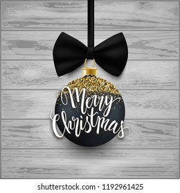 Merry Christmas calligraphic text and realistic glitter ball with bow, card, postcard, vector illustration