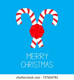 Merry Christmas. Candy Cane two peppermint stick set. Big red round bow decoration. Greeting card. Blue background. Isolated. Flat design. Vector illustration