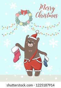Merry Christmas card. Funny cartoon bear in Santa`s costume decorates room by stockings. Garland and wreath. 