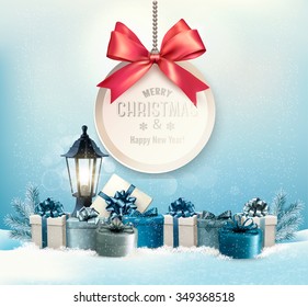 Merry Christmas card with a ribbon and gift boxes.
