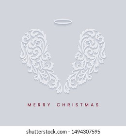 Merry Christmas card with square frame and white angel wings on a light background in the style of layered paper. Merry Christmas congratulation text. Vector illustration.