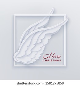 Merry Christmas card with square frame and white angel wings on a light background in the style of layered paper. Merry Christmas congratulation text. Vector illustration.