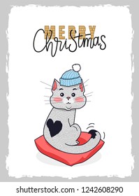 Merry Christmas cat in warm winter hat. Kitten with black heart on back sitting on pillow. Happy New Year postcard, lettering with snowflakes, vector