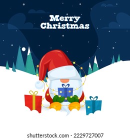 Merry Christmas Celebration Concept With Cartoon Gnome Holding Gift Box, Lighting Garland, Xmas Tree On Blue And White Snowfall Background.