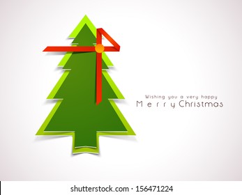 Merry Christmas celebration greeting card or background with glossy green Xmas Tree wrapped in red ribbon.