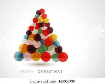 Merry Christmas celebration greeting card or invitation card with colorful Xmas tree on snowflakes decorated grey background. 