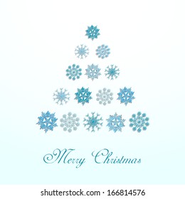 Merry Christmas celebration greeting card or invitation card with beautiful Xmas tree made by blue snowflakes. 
