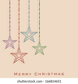 Merry Christmas celebration greeting card or invitation card with hanging colorful stars on abstract background. 