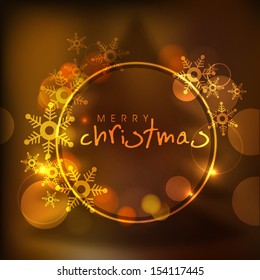 Merry Christmas celebration shiny concept with golden snowflakes. 