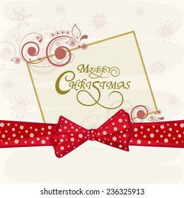 Merry Christmas celebrations greeting card design with stylish text in floral decorated frame on snowflakes decorated background.