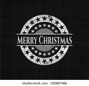 Merry Christmas chalkboard emblem written on a blackboard