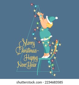 Merry Christmas. A child decorates a Christmas tree. The eve of the holiday. Colored light bulbs. Garland