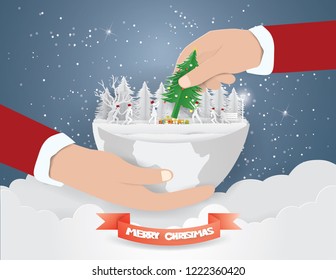 Merry Christmas concept,Hand Santa Claus Picked Christmas tree in winter background ,Paper art and Illustration style.
