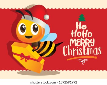 Merry Christmas. Cute bee holding a Christmas gift with big red Merry Christmas greeting card - Vector